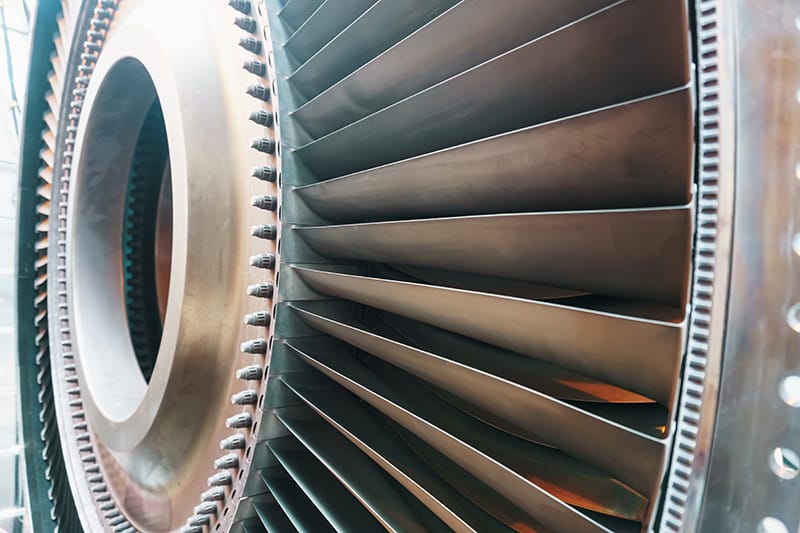 Closeup of blades from a gas turbine engine rotor disk as product from Aerospace Industry Metal Finishing