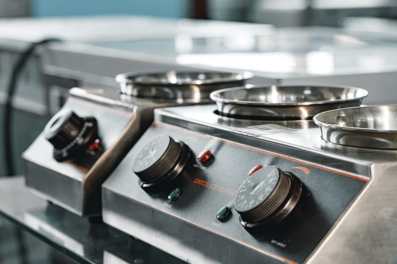 Closeup of clean new professional kitchen appliance stove