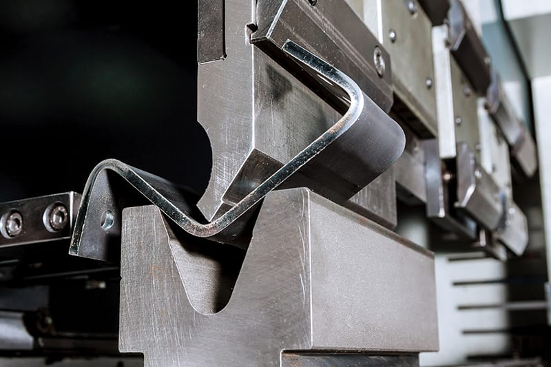 Process of bending sheet metal in hydraulic metalworking plant from the metalwork industry Deburring/Finishing Machines