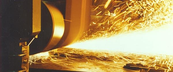 GE Machinery our service, closeup of grinding metal with sparks